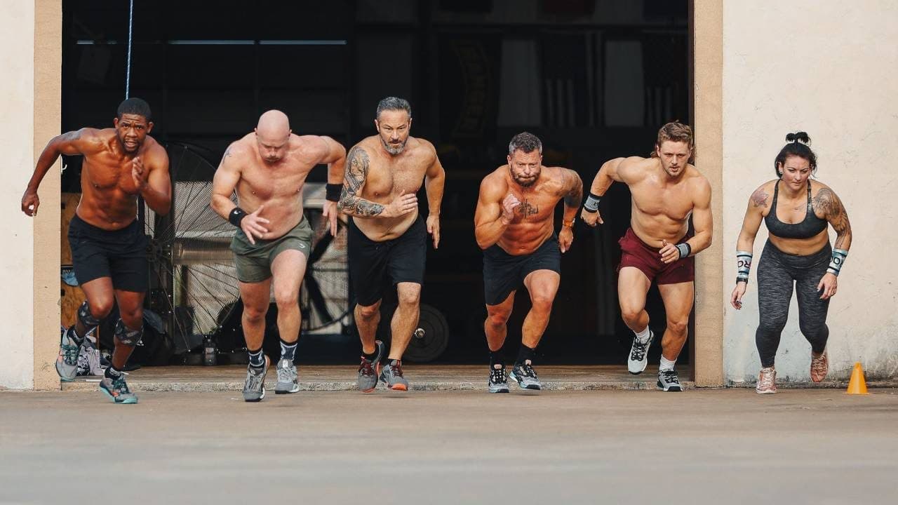 Six athletes sprinting out of a gym bay door