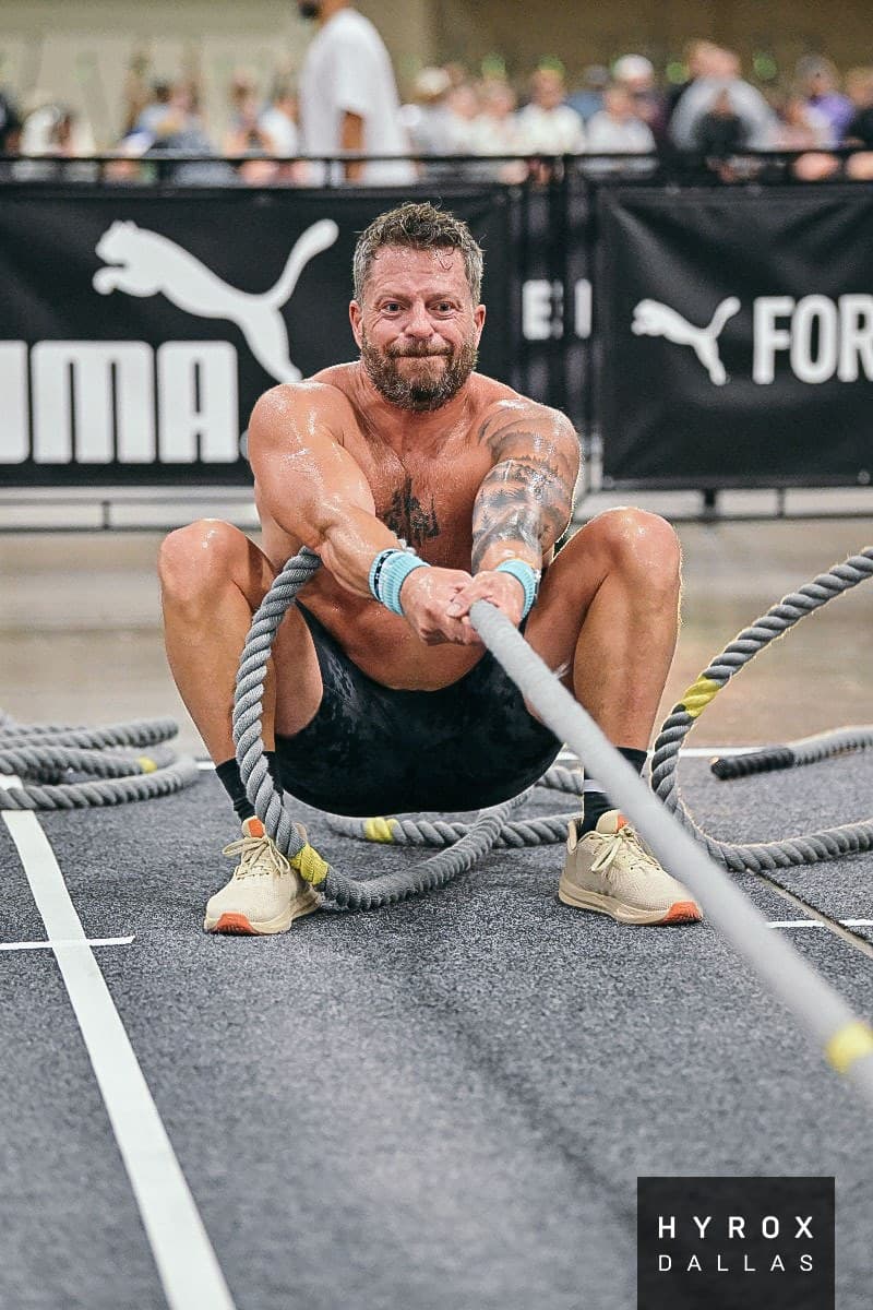 Jason Grubb pulling a sled rope at HYROX Dallas