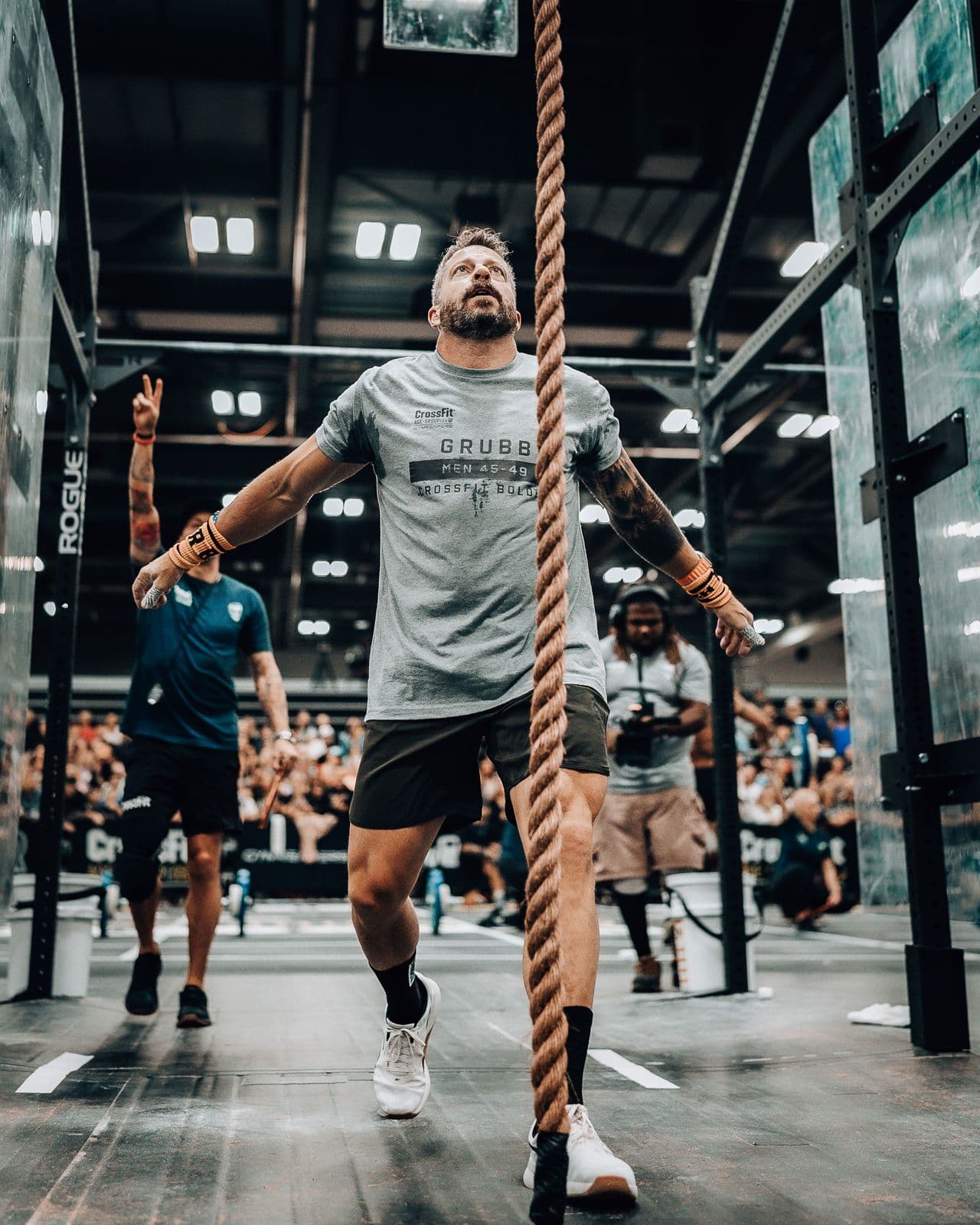 Jason Grubb finishing a rope climb in competition